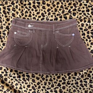 Brown Pleated Mini Skirt with White Stitching and Heart Buttons.
